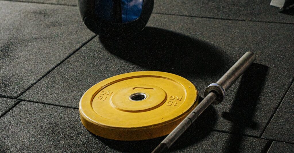 A vibrant gym setup featuring weights and fitness equipment ready for a workout.