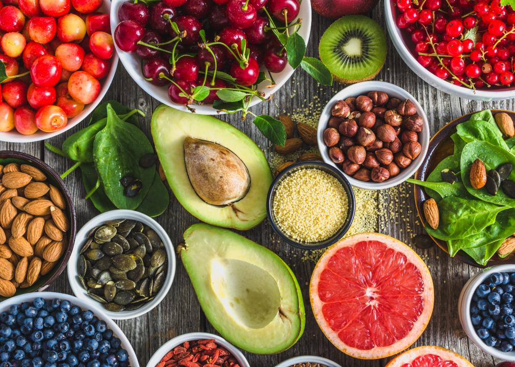 Assortment of superfoods like avocado, berries, and seeds known to address common nutrient deficiencies” — great visual emphasis for nutrient-dense foods.