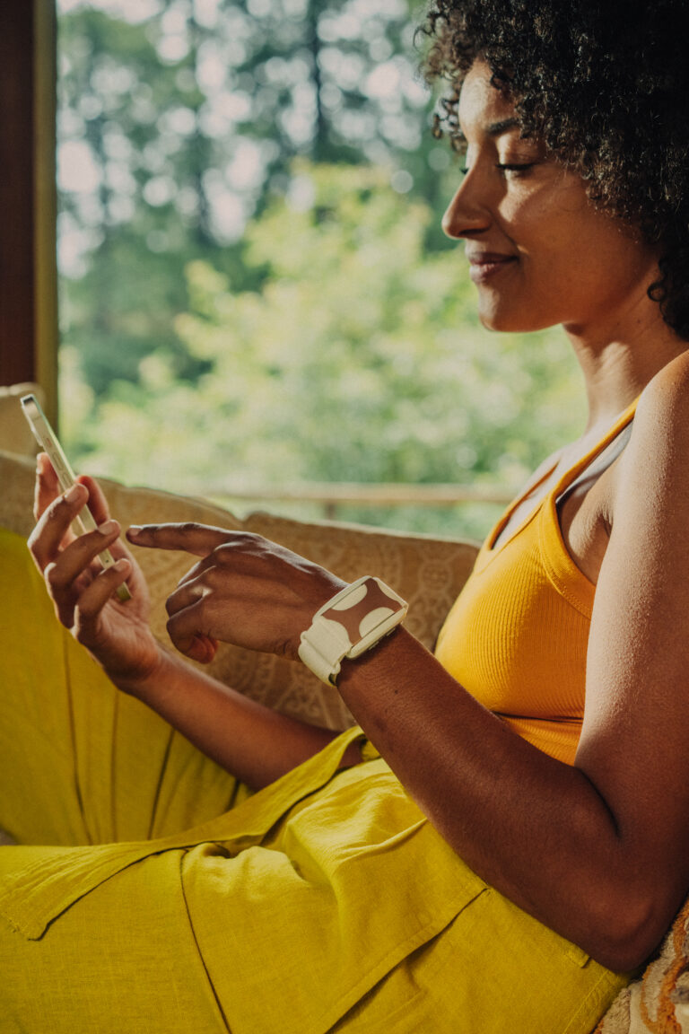 Close-up of the Apollo Neuro wearable being worn on a wrist, demonstrating the placement for nerve-root stimulation and stress relief